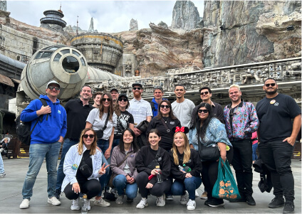 team photo in front of the Millenium Falcon